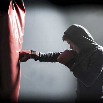 young man punching a punching bag
