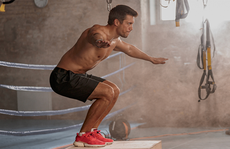man doing a box jump