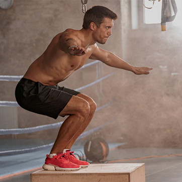 man doing box jump