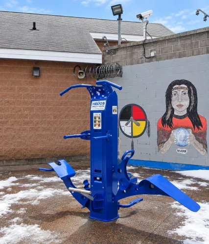 Outdoor-Fit Helios Multi-Gym providing outdoor exercise stations in a correctional facility yard