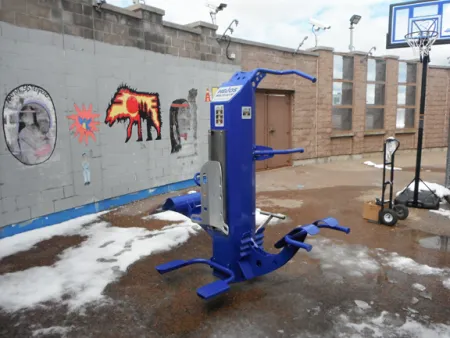 Outdoor-Fit Helios Multi-Gym installed in a secure correctional facility exercise yard