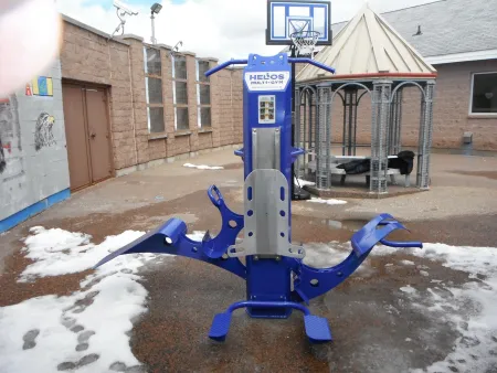Helios Multi-Gym outdoor fitness equipment in a secure correctional facility yard